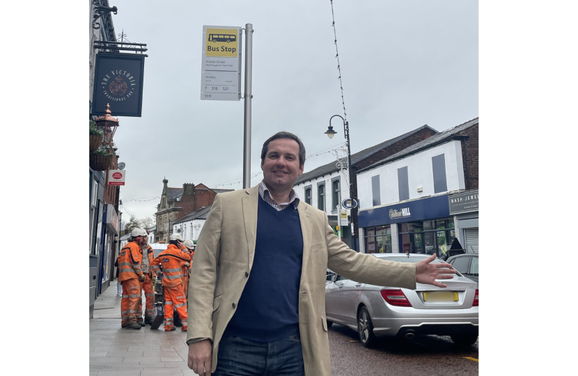 Photo of Chris at a bus stop in Westhoughton